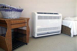 ductless-heat-pump-air-handler-on-floor