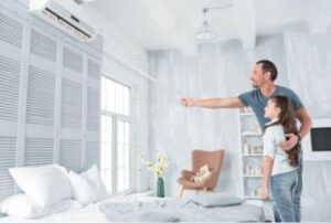 man-and-daughter-looking-at-ductless-air-handler