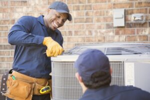 two-techs-working-on-air-conditioner